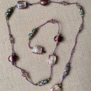 29” hand strung strand of Purple Glass Beads